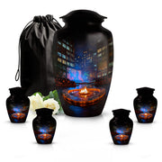 Rich Black Campfire Cremation Urn top-down view of secure threaded lid - classic sculpted campfire pattern on smooth aluminum - memorial set with one large and four small urns