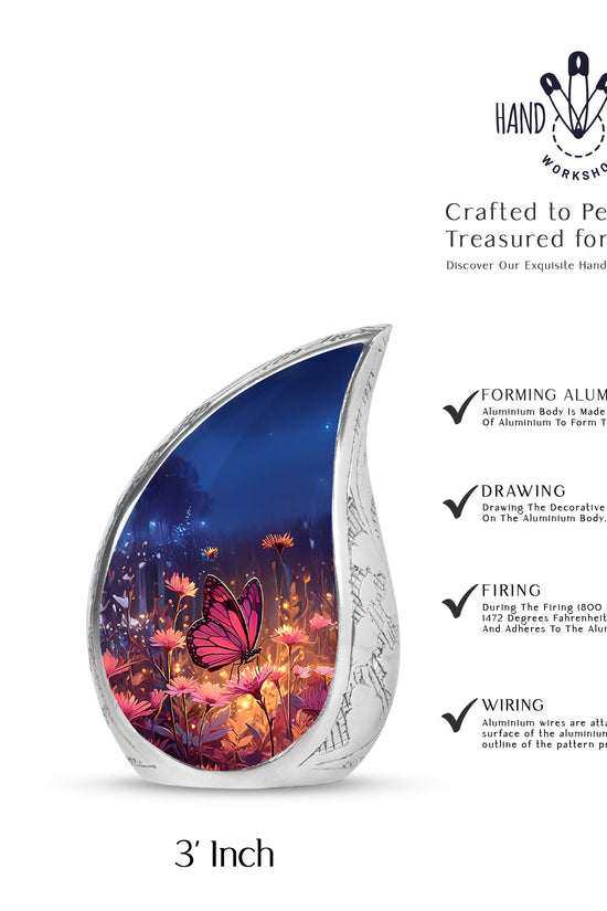 Twilight Blue Butterfly Cremation Urn angled view of lid and engraved motif - graceful tear-shaped urn with butterfly motif - mini keepsake memorial for portion of cremation ashes