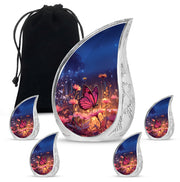 Indigo Butterfly Cremation Urn side profile showing urn shape - flowing teardrop butterfly silhouette on curved aluminum - memorial set with one large and four small urns