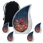 Misty Blue Butterfly Cremation Urn side profile showing urn shape - flowing teardrop butterfly silhouette on curved aluminum - memorial set with one large and four small urns