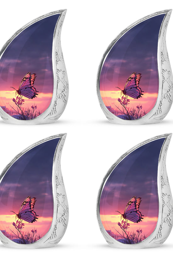 Icy Blue Butterfly Cremation Urn close-up of engraving and surface detail - flowing teardrop butterfly silhouette on curved aluminum - 10 inch aluminum urn for cremated remains