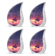 Icy Blue Butterfly Cremation Urn close-up of engraving and surface detail - flowing teardrop butterfly silhouette on curved aluminum - 10 inch aluminum urn for cremated remains
