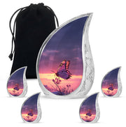 Soft Blue Butterfly Cremation Urn side profile showing urn shape - smooth teardrop contour featuring butterfly art - memorial set with one large and four small urns