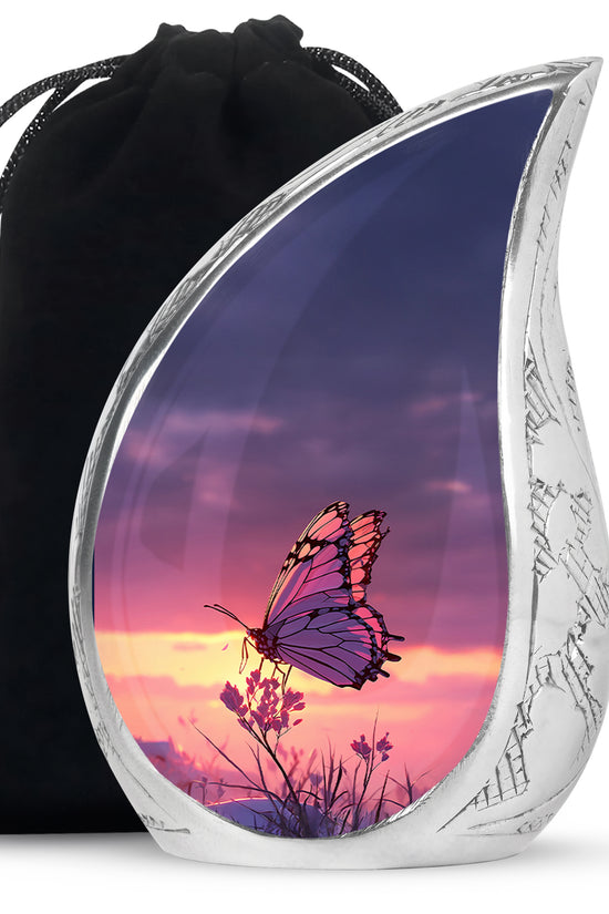 Pastel Blue Butterfly Cremation Urn front view showing detailed design - flowing teardrop butterfly silhouette on curved aluminum - full-size 10 inch 200 cubic inch adult cremation urn