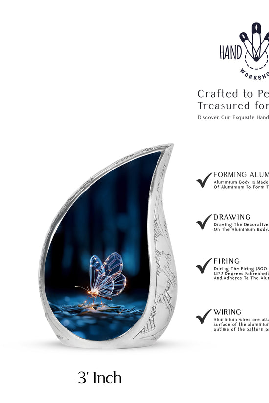 Deep Black Butterfly Cremation Urn angled view of lid and engraved motif - flowing teardrop butterfly silhouette on curved aluminum - mini keepsake memorial for portion of cremation ashes