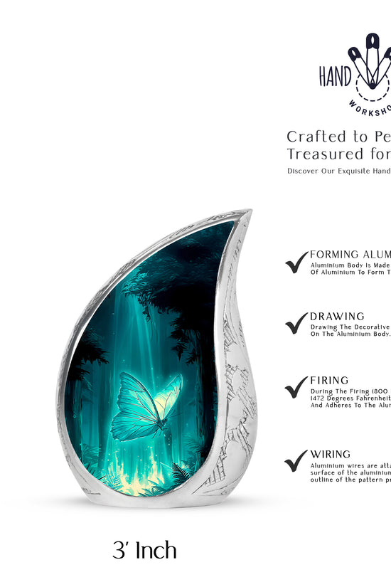 Mystic Teal Butterfly Cremation Urn angled view of lid and engraved motif - graceful tear-shaped urn with butterfly motif - mini keepsake memorial for portion of cremation ashes