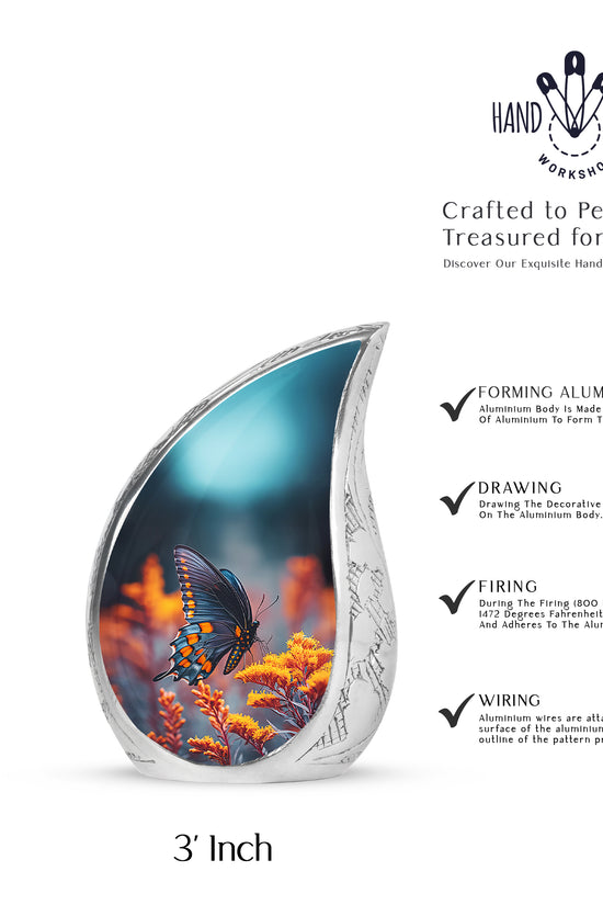Indigo Butterfly Cremation Urn angled view of lid and engraved motif - flowing teardrop butterfly silhouette on curved aluminum - mini keepsake memorial for portion of cremation ashes