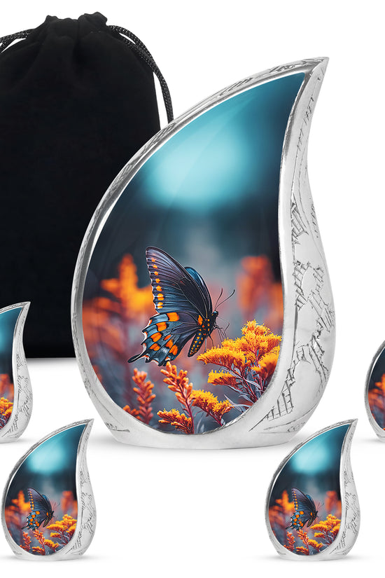 Misty Blue Butterfly Cremation Urn side profile showing urn shape - flowing teardrop butterfly silhouette on curved aluminum - memorial set with one large and four small urns