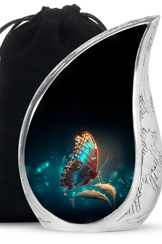 Deep Black Butterfly Cremation Urn front view showing detailed design - flowing teardrop butterfly silhouette on curved aluminum - full-size 10 inch 200 cubic inch adult cremation urn