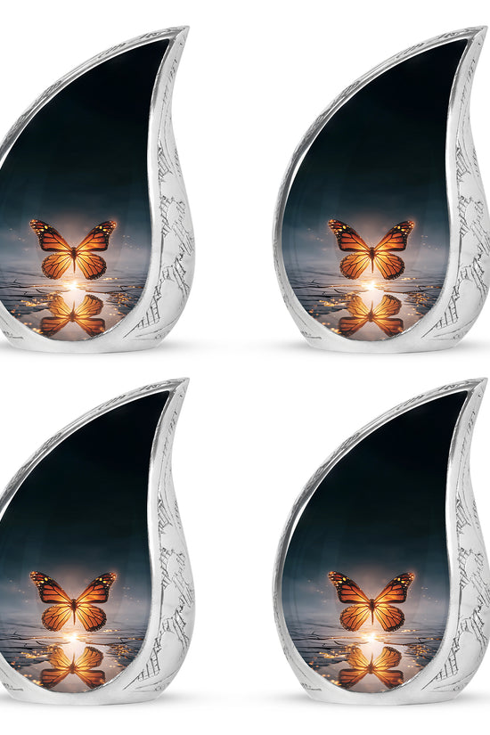 Azure Butterfly Cremation Urn close-up of engraving and surface detail - flowing teardrop butterfly silhouette on curved aluminum - 10 inch aluminum urn for cremated remains