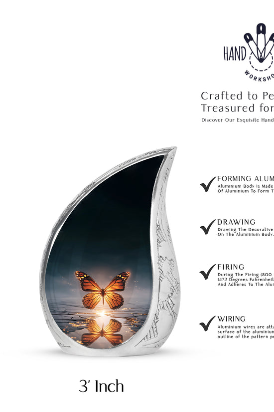 Dusty Blue Butterfly Cremation Urn angled view of lid and engraved motif - rounded teardrop butterfly design with delicate detail - mini keepsake memorial for portion of cremation ashes