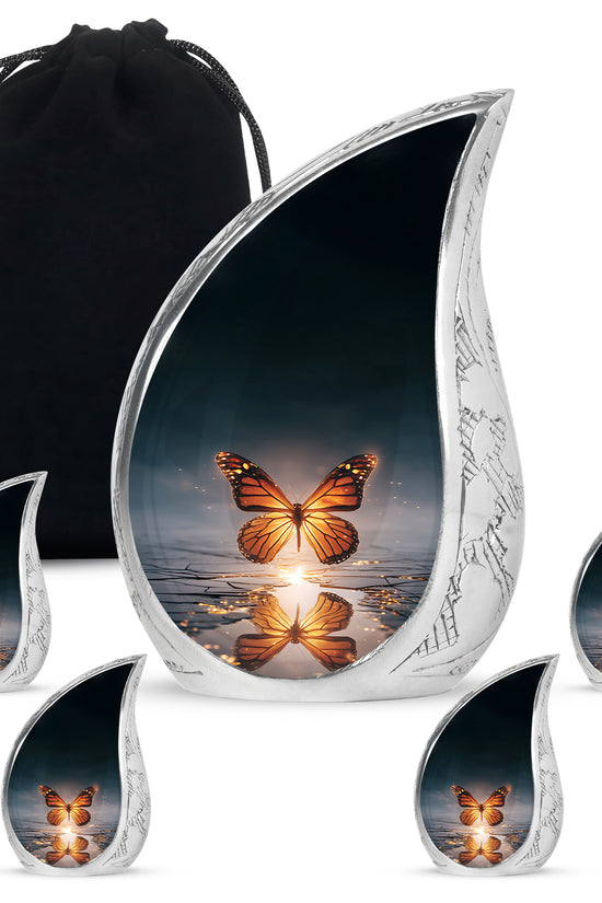 Royal Blue Butterfly Cremation Urn side profile showing urn shape - graceful tear-shaped urn with butterfly motif - memorial set with one large and four small urns