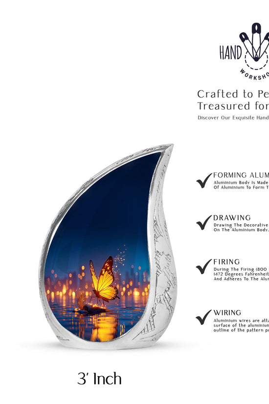 Calming Blue Butterfly Cremation Urn angled view of lid and engraved motif - smooth teardrop contour featuring butterfly art - mini keepsake memorial for portion of cremation ashes