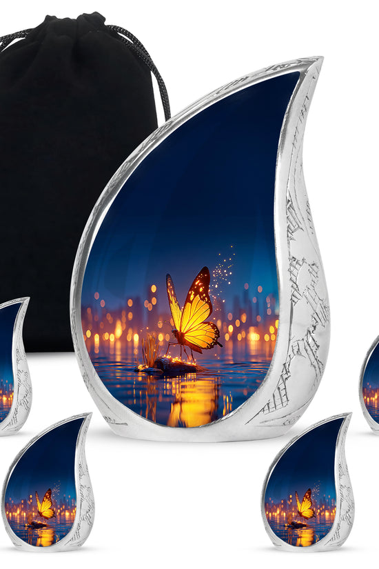 Indigo Butterfly Cremation Urn side profile showing urn shape - flowing teardrop butterfly silhouette on curved aluminum - memorial set with one large and four small urns