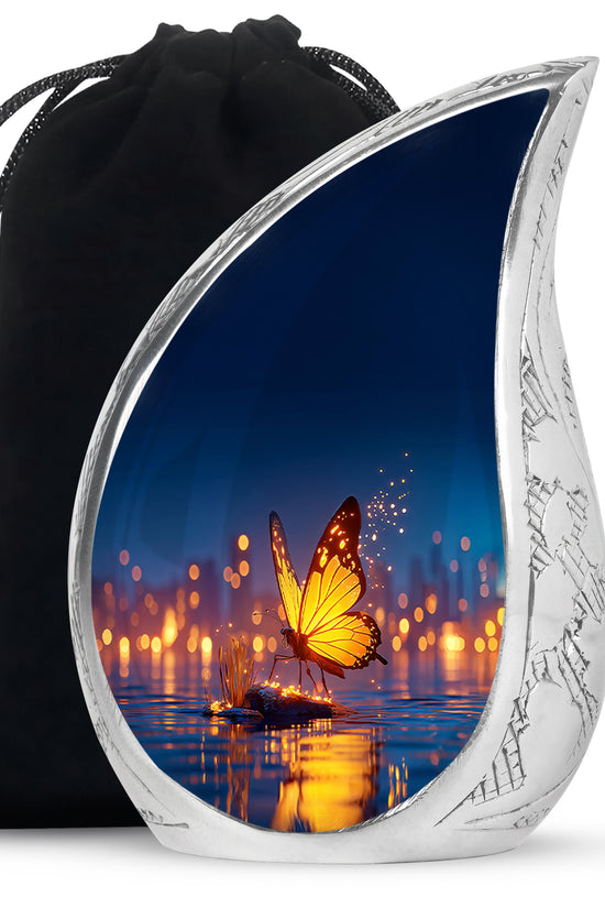 Azure Butterfly Cremation Urn front view showing detailed design - flowing teardrop butterfly silhouette on curved aluminum - full-size 10 inch 200 cubic inch adult cremation urn
