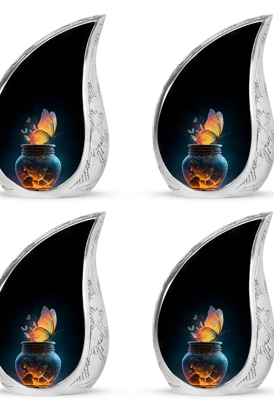 Obsidian Black Butterfly Cremation Urn close-up of engraving and surface detail - smooth teardrop contour featuring butterfly art - 10 inch aluminum urn for cremated remains
