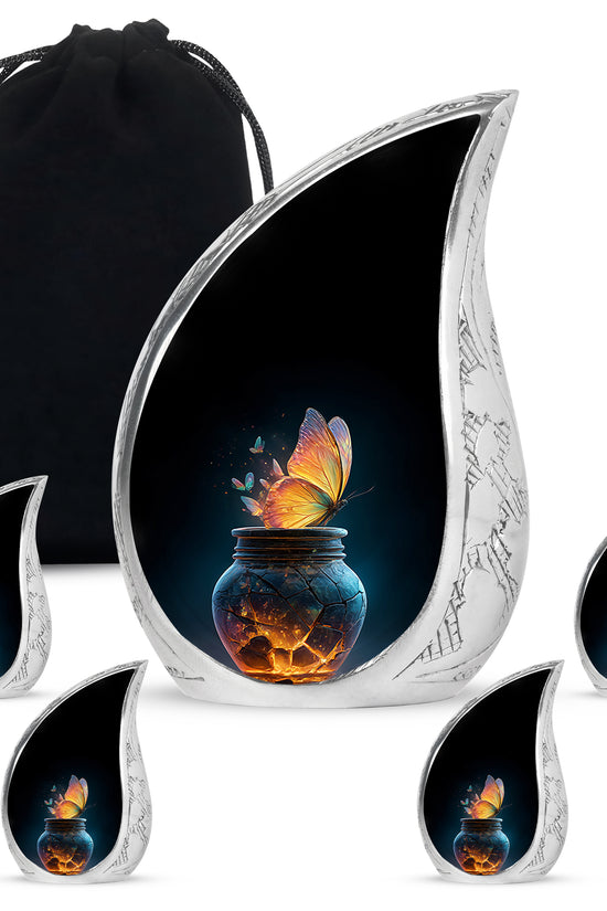 Glossy Black Butterfly Cremation Urn side profile showing urn shape - rounded teardrop butterfly design with delicate detail - memorial set with one large and four small urns