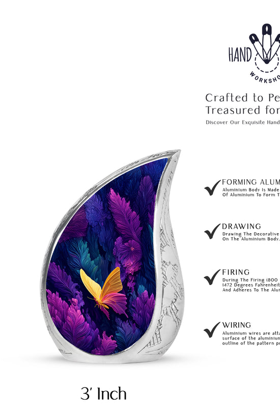 Vivid Blue Butterfly Cremation Urn angled view of lid and engraved motif - smooth teardrop contour featuring butterfly art - mini keepsake memorial for portion of cremation ashes