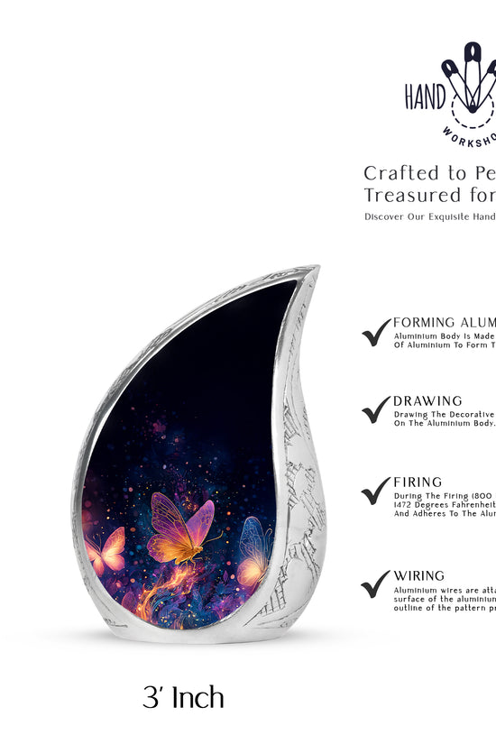 Rich Black Butterfly Cremation Urn angled view of lid and engraved motif - rounded teardrop butterfly design with delicate detail - mini keepsake memorial for portion of cremation ashes