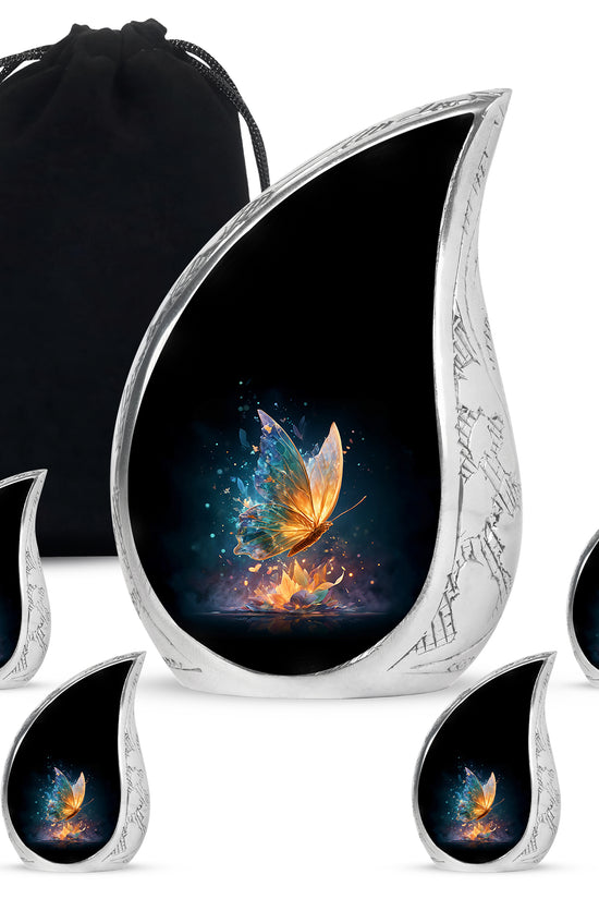 Deep Black Butterfly Cremation Urn side profile showing urn shape - flowing teardrop butterfly silhouette on curved aluminum - memorial set with one large and four small urns