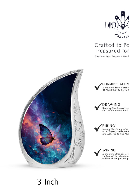 Royal Blue Butterfly Cremation Urn angled view of lid and engraved motif - smooth teardrop contour featuring butterfly art - mini keepsake memorial for portion of cremation ashes