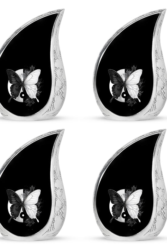 Onyx Black Butterfly Cremation Urn close-up of engraving and surface detail - graceful tear-shaped urn with butterfly motif - 10 inch aluminum urn for cremated remains