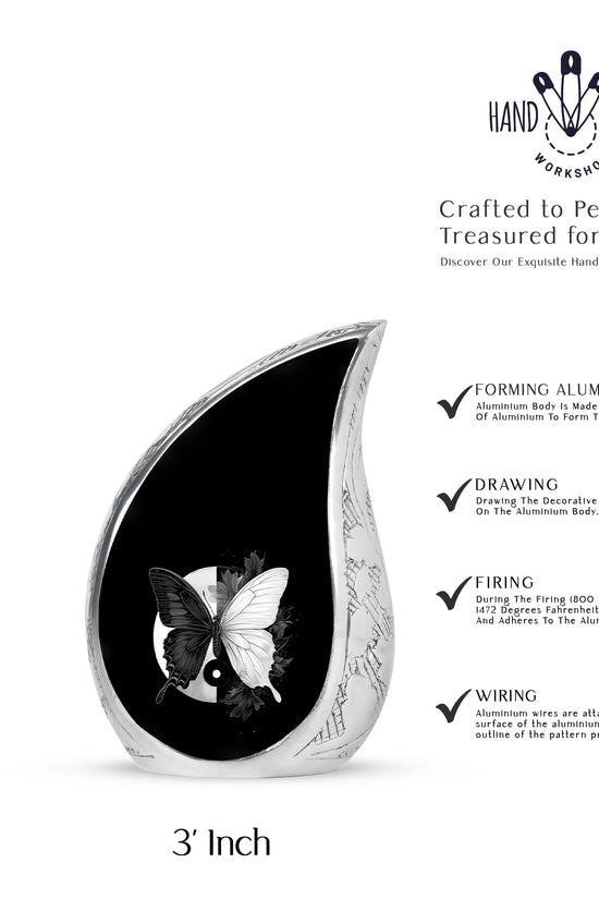 Glossy Black Butterfly Cremation Urn angled view of lid and engraved motif - flowing teardrop butterfly silhouette on curved aluminum - mini keepsake memorial for portion of cremation ashes