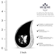 Glossy Black Butterfly Cremation Urn angled view of lid and engraved motif - flowing teardrop butterfly silhouette on curved aluminum - mini keepsake memorial for portion of cremation ashes