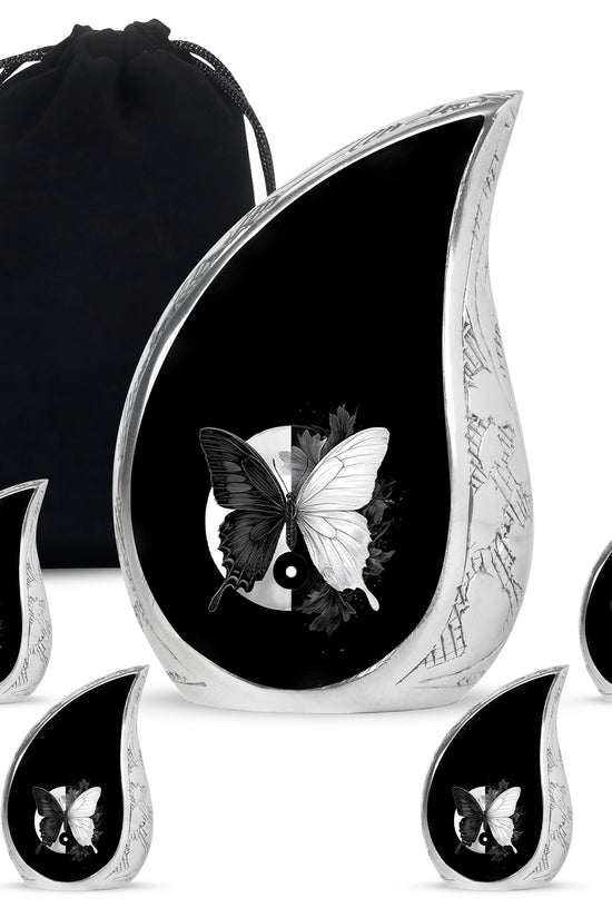 Dark Black Butterfly Cremation Urn side profile showing urn shape - smooth teardrop contour featuring butterfly art - memorial set with one large and four small urns