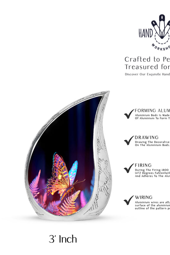 Jet Black Butterfly Cremation Urn angled view of lid and engraved motif - flowing teardrop butterfly silhouette on curved aluminum - mini keepsake memorial for portion of cremation ashes