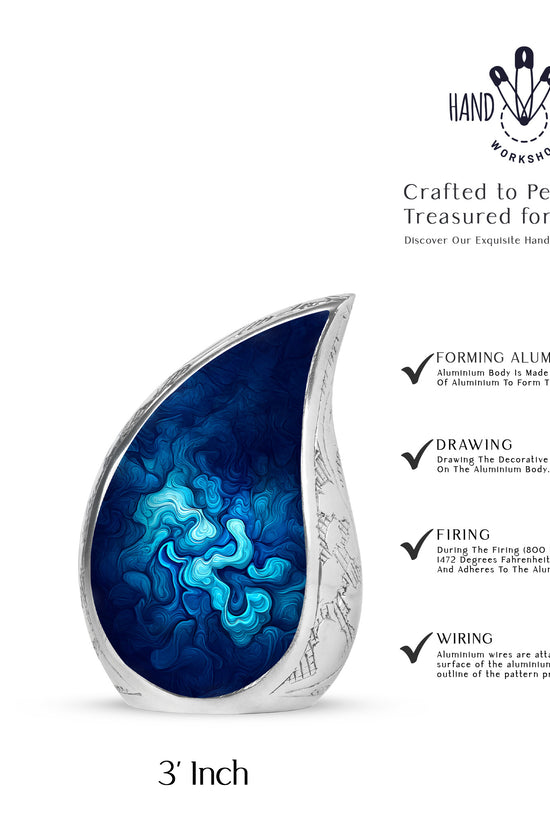 Celestial Blue Blue Cremation Urn angled view of lid and engraved motif - flowing teardrop blue silhouette on curved aluminum - mini keepsake memorial for portion of cremation ashes