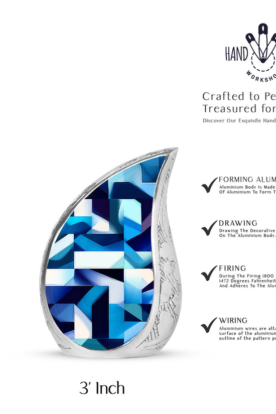 Twilight Blue Blue Cremation Urn angled view of lid and engraved motif - graceful tear-shaped urn with blue motif - mini keepsake memorial for portion of cremation ashes