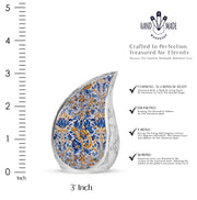 Steel Gray Blue Cremation Urn angled view of lid and engraved motif - smooth teardrop contour featuring blue art - mini keepsake memorial for portion of cremation ashes