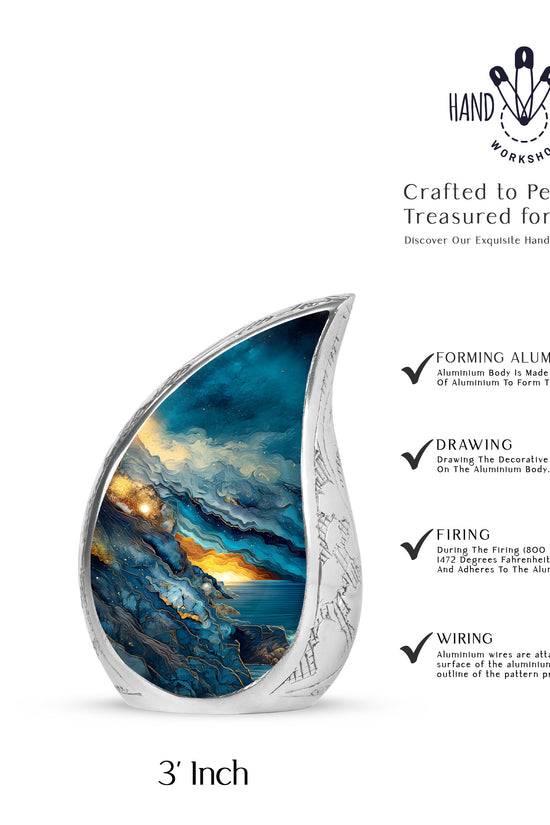 Sapphire Blue Blue Cremation Urn angled view of lid and engraved motif - smooth teardrop contour featuring blue art - mini keepsake memorial for portion of cremation ashes