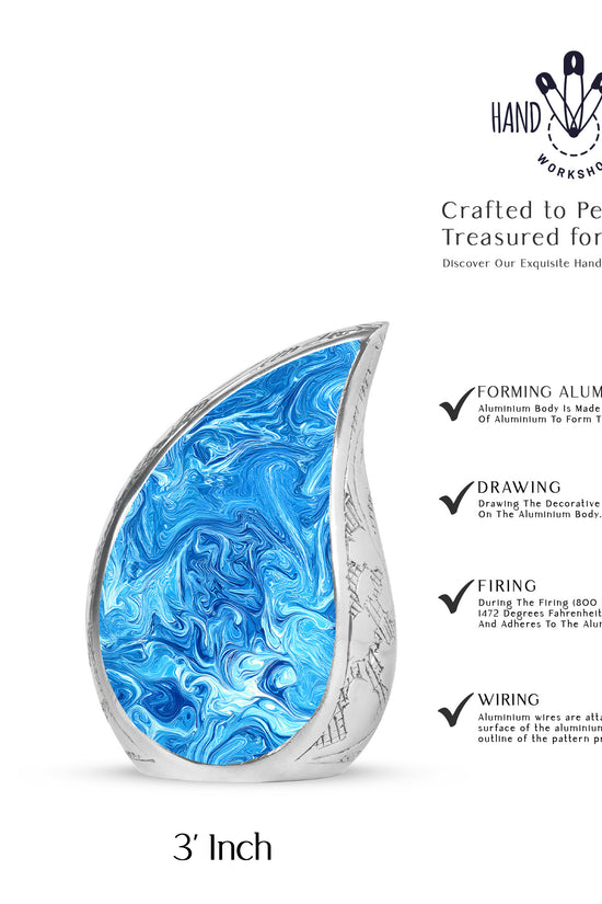 Bright Blue Blue Cremation Urn angled view of lid and engraved motif - graceful tear-shaped urn with blue motif - mini keepsake memorial for portion of cremation ashes