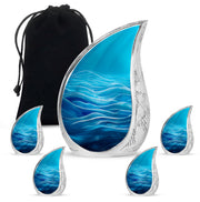 Azure Blue Cremation Urn side profile showing urn shape - flowing teardrop blue silhouette on curved aluminum - memorial set with one large and four small urns
