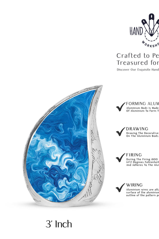 Bright Blue Blue Cremation Urn angled view of lid and engraved motif - graceful tear-shaped urn with blue motif - mini keepsake memorial for portion of cremation ashes