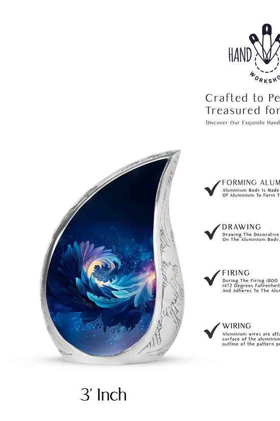 Steel Blue Blue Cremation Urn angled view of lid and engraved motif - smooth teardrop contour featuring blue art - mini keepsake memorial for portion of cremation ashes