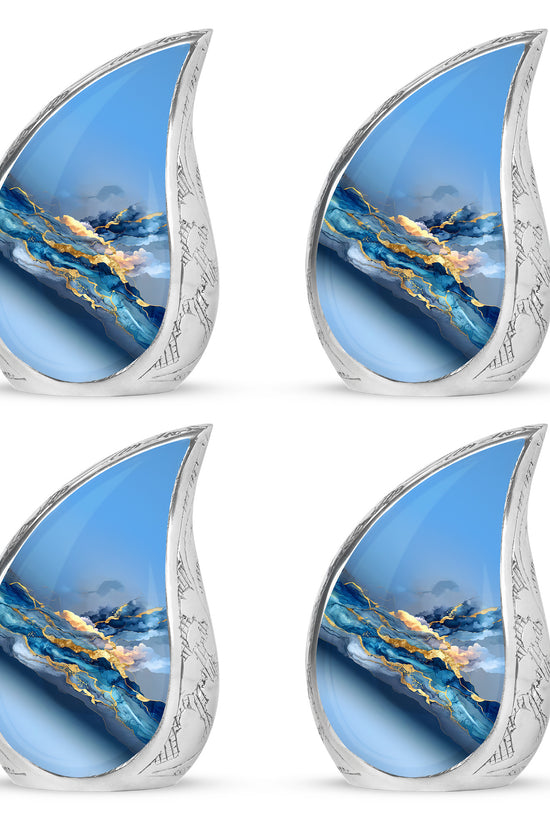 Soft Blue Blue Cremation Urn close-up of engraving and surface detail - smooth teardrop contour featuring blue art - 10 inch aluminum urn for cremated remains