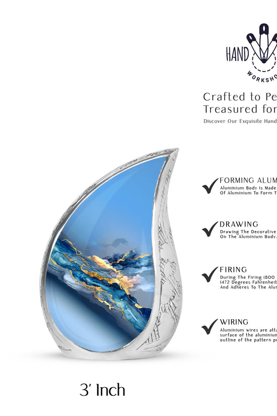 Serene Blue Blue Cremation Urn angled view of lid and engraved motif - smooth teardrop contour featuring blue art - mini keepsake memorial for portion of cremation ashes
