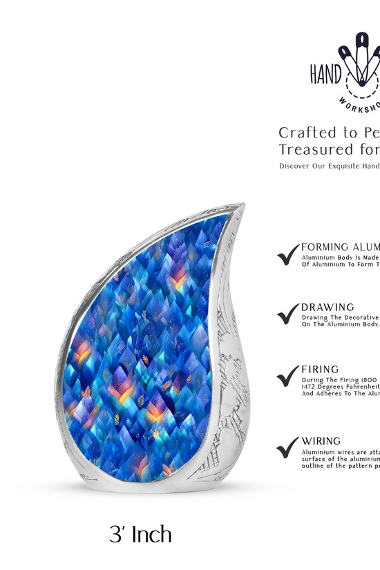 Slate Blue Blue Cremation Urn angled view of lid and engraved motif - flowing teardrop blue silhouette on curved aluminum - mini keepsake memorial for portion of cremation ashes