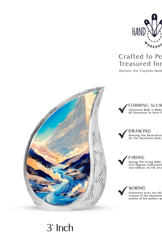 Steel Blue Blue Cremation Urn angled view of lid and engraved motif - smooth teardrop contour featuring blue art - mini keepsake memorial for portion of cremation ashes