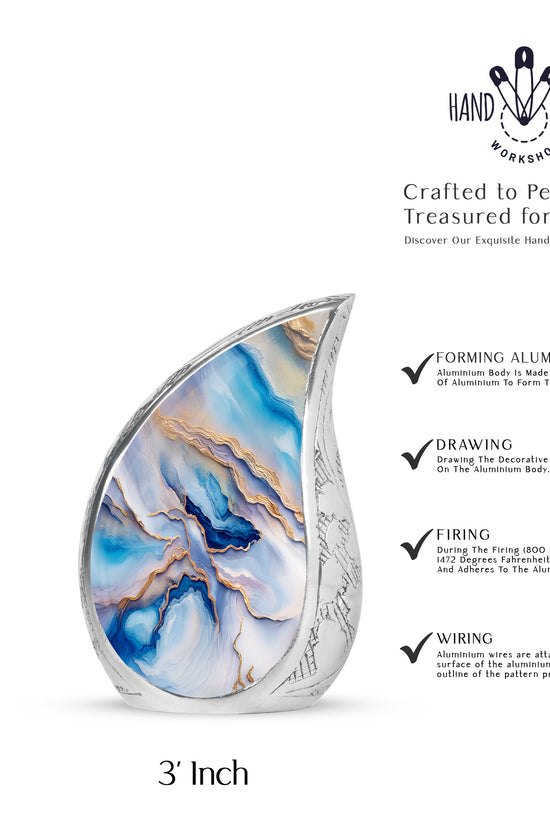 Cobalt Blue Blue Cremation Urn angled view of lid and engraved motif - graceful tear-shaped urn with blue motif - mini keepsake memorial for portion of cremation ashes
