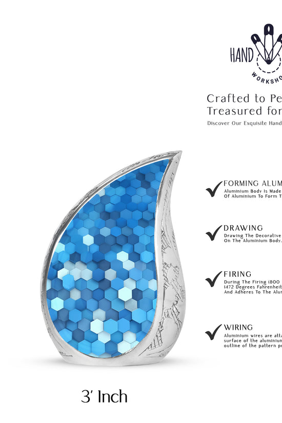 Powder Blue Blue Cremation Urn angled view of lid and engraved motif - rounded teardrop blue design with delicate detail - mini keepsake memorial for portion of cremation ashes