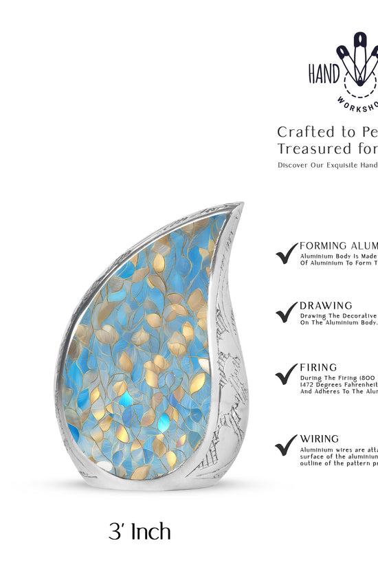 Calming Blue Blue Cremation Urn angled view of lid and engraved motif - smooth teardrop contour featuring blue art - mini keepsake memorial for portion of cremation ashes