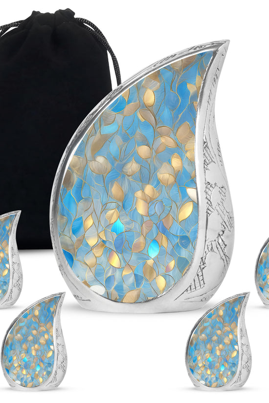 Dusty Blue Blue Cremation Urn side profile showing urn shape - rounded teardrop blue design with delicate detail - memorial set with one large and four small urns