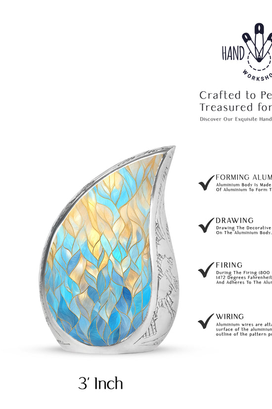 Sky Blue Blue Cremation Urn angled view of lid and engraved motif - rounded teardrop blue design with delicate detail - mini keepsake memorial for portion of cremation ashes