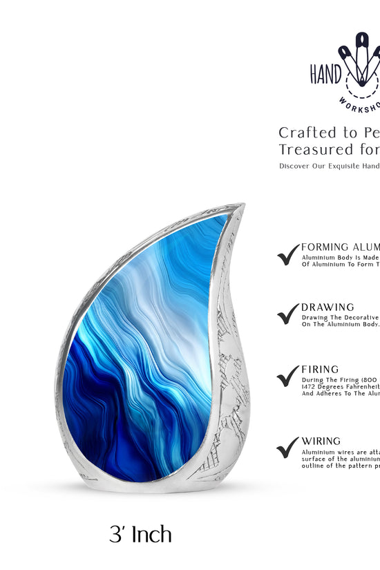 Misty Blue Blue Cremation Urn angled view of lid and engraved motif - rounded teardrop blue design with delicate detail - mini keepsake memorial for portion of cremation ashes