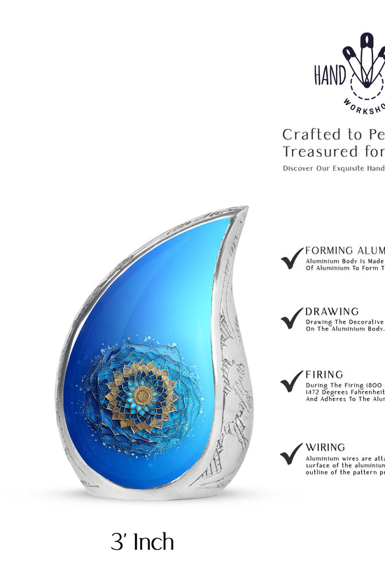 Mystic Teal Blue Cremation Urn angled view of lid and engraved motif - graceful tear-shaped urn with blue motif - mini keepsake memorial for portion of cremation ashes