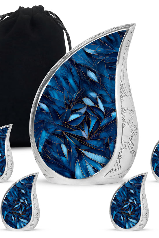 Icy Blue Blue Cremation Urn side profile showing urn shape - flowing teardrop blue silhouette on curved aluminum - memorial set with one large and four small urns